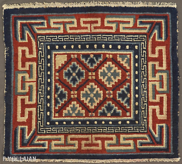 This is an antique Tibetan mat rug woven during the beginning of the 20th century circa 1900-1920 and measures 81x 68CM in size. its field is comprised of lattice design using geometric  ...