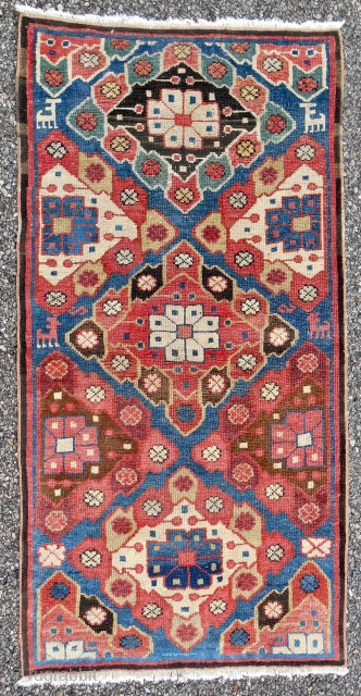 Uncommon Iraqi Kurdish small rug. 2 x 4ft. Circa 1850 or older. Bold design, clear color and in good condition.             