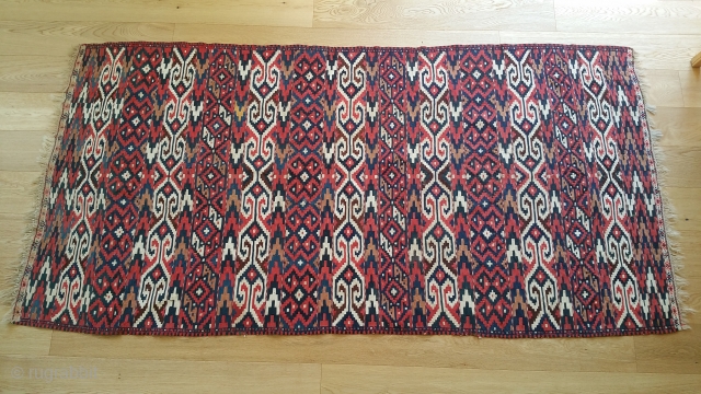 Antique Turkmen Yomud Kilim.
42 inches wide by 86 inches long.
Interlocked tapestry weave.
Small brocade band at each end.
Design elements found in other Turkmen and Uzbeki kelims and tent bands.
Sometime referred to as Bokhara  ...