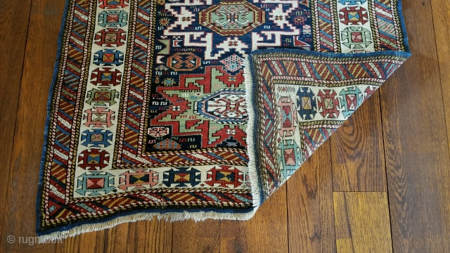 Antique Kuba carpet. Lesghi star design.
The half star is original.  The rug was not cut and spliced.
Uniform medium pile.  Professional repair of pucker in border. 
36 inches wide by 76  ...