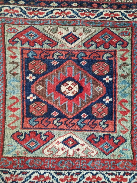 Interesting Kurdish bag from north west Persia. Note the flatweave back is not connected at the sides and there is a little damage to one corner.
52 x 54 cm    