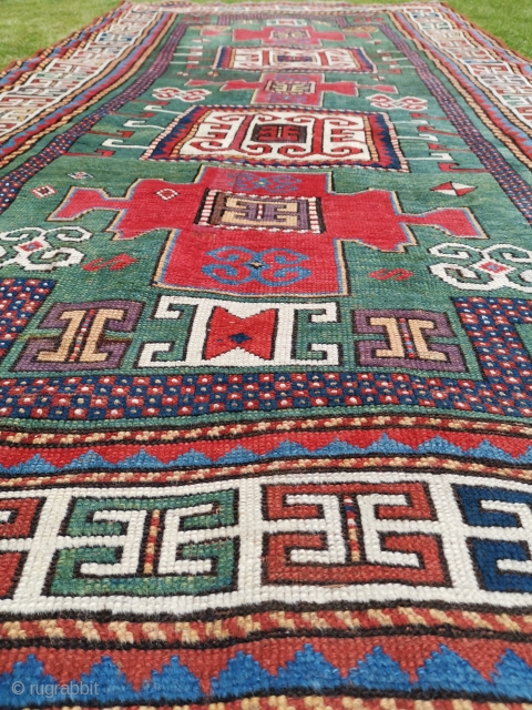 Good old Karachop Kazak with a beautiful green field.
Some repair and a little wonky.
244cm x 135cm (8’ x 4’5)              
