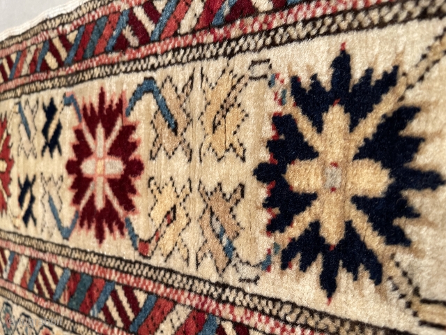 This circa 1875 Kuba Runner #7414 measures 3’2” X 13’2” (97 x 401 cm). This is an interesting long rug. It has a latticework design containing innumerable different flower motifs worked in  ...