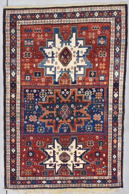 This circa 1875 Kuba measures 3’8” X 5’7”. This is a Kuba in a Leshgi design. The center, which I’ve never seen laid out like this, is a dark blue rectangle with  ...