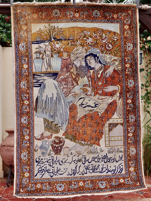 A fine, silk pictorial Tabriz rug. 185 x 124 cm. around 1910, depicting Omar Khayyam with his muse. The calligraphy at the bottom is a text from his famous Quatrains. Condition: Overall  ...