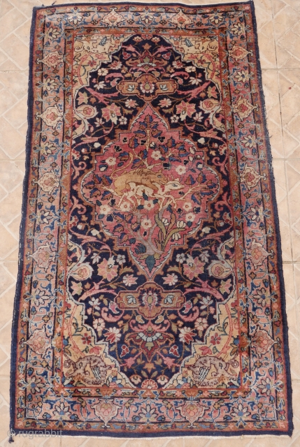 An antique Tabriz rug, 80 x 145 cm (2.6ft x 4.7ft) around 1920 The central medallion with "Lion and Lamb" motifs. This is an ancient religious theme, indicating that the hunter and  ...