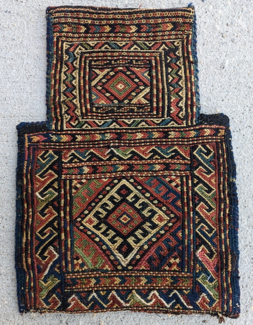  A finely woven Kurd Soumak saltbag, circa 1930 or before, has a beautiful range of natural dyes with a beautifully multi-colored back. In excellent condition, size 1" by 1'5"   