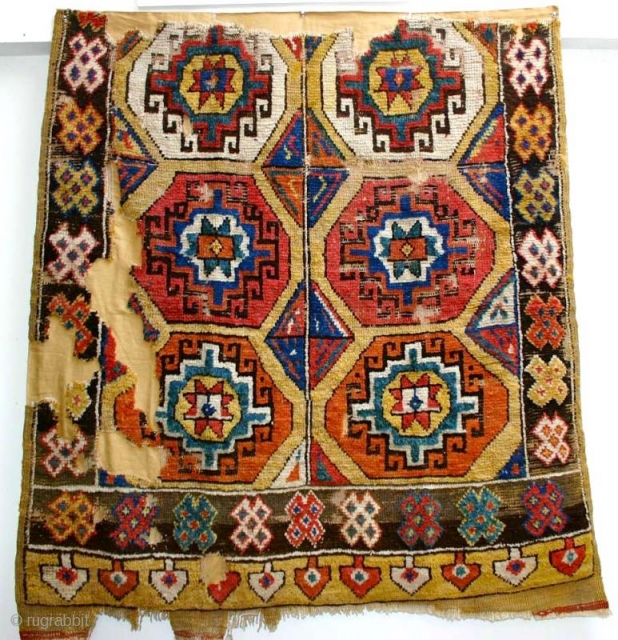 Brilliant Konya Rug fragment.  This is the older version of these "Memling Gol" yellow ground Konya Yataks. It has the large Memlings with equally dynamic center diamond motifs holding the design  ...