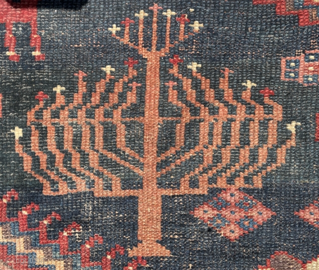 A very rare jewish carpet decorated with a jewish candlestick on all four corners… circa 1800s                 