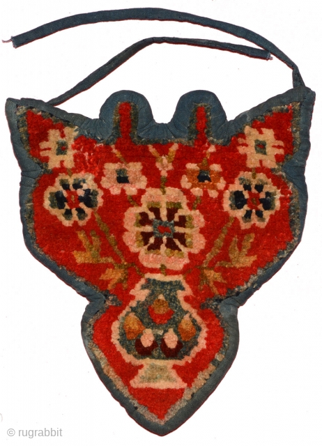 Tibetan takyeb (pack animal forehead ‘decoration’) showing flowers emanating from a vase filled with flaming jewels. Hand spun wool warp and weft, rich saturated natural dyes, and made sometime in the early  ...