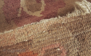 



Tibetan Khaden rug with auspicious bats and scrolling peony pattern.  L: 160cm/62in and W: 94cm/37in. Undyed wool warp and weft and the pile may be possibly undyed as well, quite unusual  ...