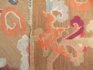 



Tibetan Khaden rug with auspicious bats and scrolling peony pattern.  L: 160cm/62in and W: 94cm/37in. Undyed wool warp and weft and the pile may be possibly undyed as well, quite unusual  ...