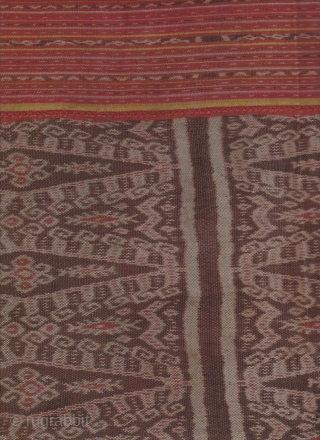 Semi antique Timor sarong made from all natural dyes and handspun cotton circa 1950/1960. Both top and bottom have “buna” weft embroidered panels. There is a 7cm x 4cm piece missing on  ...