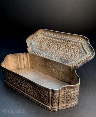
Fine and elegant 19th century Sri Lanka repoussé and chased silver box. Excellent condition, except a few tiny dents on the bottom edges.  L: 14.2cm/5.6in x W: 4.2cm/1.6in x H: 6.2cm/2.4in.

http://www.abhayaasianantiques.com/items/1449233/Sri-Lanka-Silver-Trinket-Box

 