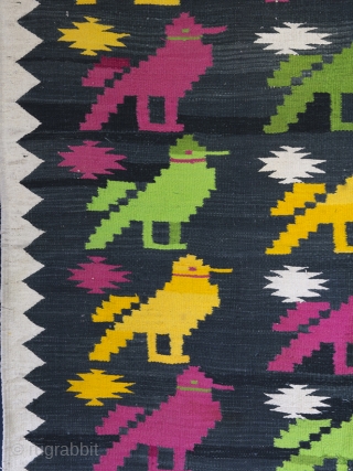 Mid Century Dhurrie rug, 203cm x 104cm (80 inches x 41 inches)

A cheerful and very charming rug from Rajasthan, circa 1950. The central field with rows of brightly woven birds drawn, in  ...