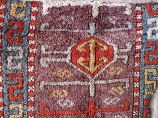 East Anatolian Kurdish Rug, Great Colors, especially the purple ground, Great Wool, blue wefted with traces of brocaded ends at the bottom. Great graphic quality. Very good age, fragmented and mounted. There  ...