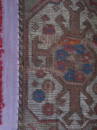 East Anatolian Rug with Transylvanian Border. Great graphics, 3 medallions nicely drawn with an assortment of scorpions. Good colors with an unusual subdued palette. Condition is fair with scattered old "repair" and  ...