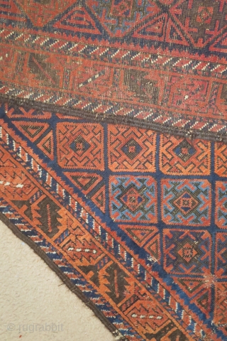 Baluch rug with serrated ashik-like tile design and a leaf border. Several blues, nice color in general. Goat hair side selvedge. 3'6"x6'3"           