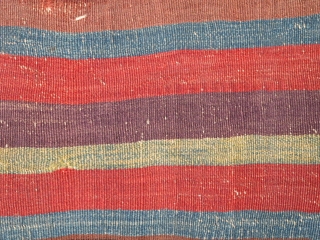 Colorful and very old fragment of a flat-woven East Anatolian chuval with well-drawn Memling guls and kilim stripes.               