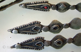 Pashtun Head Ornament, was worn either on the head or as a necklace.
Each of the 14 pieces is 19cm long and is made from metal with a low silver content.Afghan/Pakistan Border Region.  ...