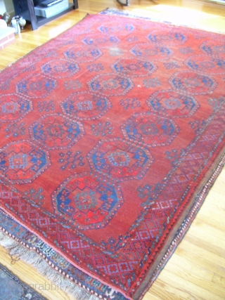7'4" x 9'6" old ersari rug, with some nice open space and colors, but also a second red that's not all natural, some wear areas, and one 4" x 1.5" little cut  ...