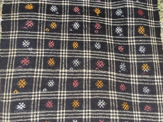 Goat hair kilim. Cm 113x243. Early to mid 20th century. Eastern Anatolia. Black & white checkered pattern with over hundred embroidered "guls". See description in here: http://rugrabbit.com/node/167998
      
