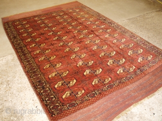 Antique Tekke Turkmen main carpet with 4 rows of 12 octagonal guls. www.knightsantiques.co.uk Size: 9ft 6in x 5ft 11in (290 x 180cm). 

Mid 19th century or earlier.

A rare Tekke Turkmen main carpet,  ...