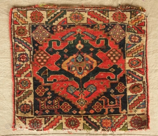 Qashqa'i saddle bag face, 19th century. Five to seven deeply saturated colors. Deep green in the central crab medallion with a slightly lighter shade in the top section.  More evident seen  ...
