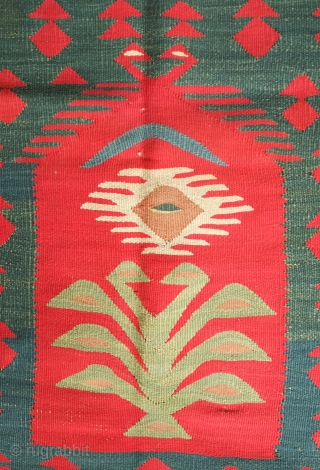 Sarkoy kilim, 19th century.  Nine niches with bird-headed trees of life topped with an evil eye or sun motif on a green ground.  In general very good condition. 108 x  ...