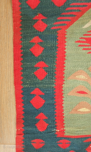 Sarkoy kilim, 19th century.  Nine niches with bird-headed trees of life topped with an evil eye or sun motif on a green ground.  In general very good condition. 108 x  ...