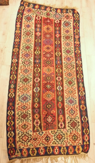 Gumusane or Kagizman kilim, late 19th century.  Wonderful colors on this tribal kilim.  Note the wear in the upper left hand corner.  128 x 288 cm    