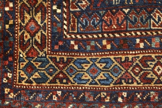Beautiful Khamseh mat with rare square size (108x103cm). Outstanding colors combination on blue background. Full of symbols and tribal motives. See the green, yellow, brick red, ecru, white and blue and then  ...