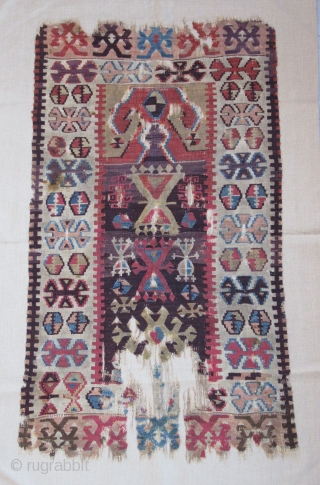Prayer Kilim fragment....Central Anatolia ( Yesilova ? )...before 1825....professionally mounted on linen....frag size/ 2'4" x 4'2" (70cm x 130cm ) excellent patinated vegetal dyes....
condition as shown .      