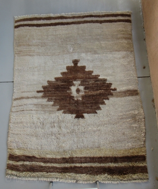 Central Anatolia...Karapinar Tulu Yatak (4'6" x 6'3") (140 x 190cm )....wool and Angora goat-hair...circa 1910....fair condition as shown with worn areas and (2) patches .        
