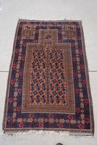 Wonderful 19th century Antique Baluch prayer rug. It's mostly medium pile with some colors which have corroded over the years. Soft wool. Rare with the rosettes on the main tree of life  ...