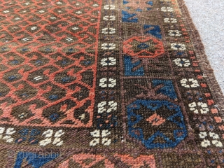 Fun little old Baluch. Great for use as a scatter rug or any space. Love that glowing red field to outline the botehs. 

5ft6in x 3ft1in or 168 x 94cm

Low pile, one  ...