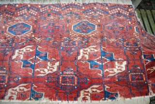 Antique Tekke main carpet fragment, 65 x 228 cm, condition issues, moth bites                    