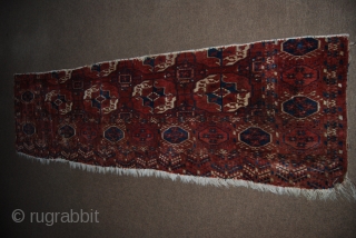 Antique Tekke main carpet fragment, 65 x 228 cm, condition issues, moth bites                    