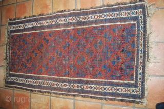 Old Baluch rug, 83 x 159 cm, traces of use, oxidation (brown), small losses at top and bottom               