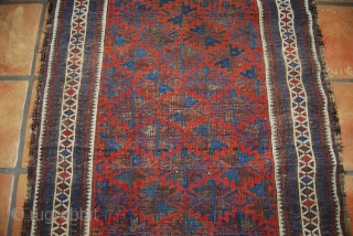 Old Baluch rug, 83 x 159 cm, traces of use, oxidation (brown), small losses at top and bottom               