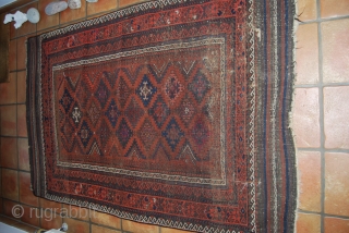 Antique Baluch carpet, 19th c., 120 x 185 (with kilim ends), some knots with fuchsin, condition issues, thin, several small holes            