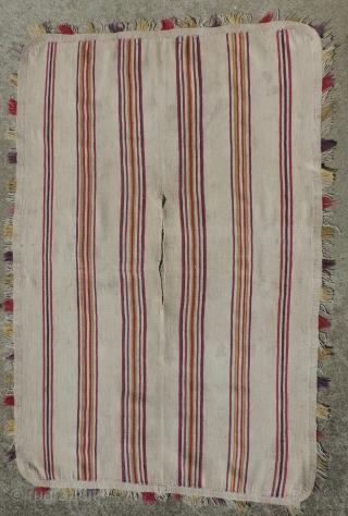 A unique, white ground Aymara Ponchito (small poncho). Altiplano region, Bolivia. Early 19th Century or before. One of a kind cotton and alpaca man's ceremonial overgarment. The only ponchito of the type  ...