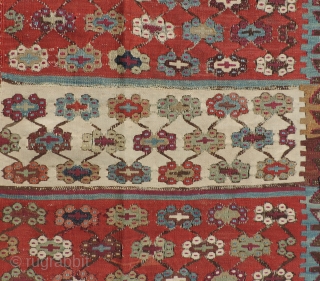 This 19th Century Reyhanli Kilim has beautiful saturated, naturally dyed colors and is in decent condition with some wear and repairs. Size: 64 x 140 inches.  As is condition - Reasonable. 