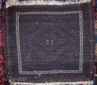 Somber Baluch bagface.  Full pile.  Has small tear (secured) in lower right corner.                  