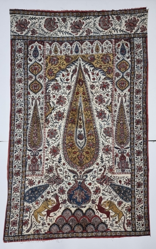 Kalamkari Palampore from South India. India. 
Hand-Drawn Mordant-And Resist-Dyed Cotton, with exotic birds, peacocks, tigers, stylized mountain and cypress trees all within mihrab.

Made for Export Market, 

Late 19th Early 20th Century. 

Its  ...
