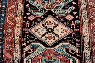 Great tribal character in this unusual Kurdish rug from the Transcaucasus with a Lenkoran-inspired pattern, last quarter 19c. Note the diverse range of village people and assorted creatures of many types. Long  ...