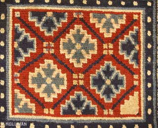 This is an antique Tibetan mat rug woven during the beginning of the 20th century circa 1900-1920 and measures 81x 68CM in size. its field is comprised of lattice design using geometric  ...