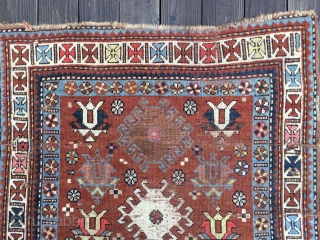Unusual Antique Caucasian Rug, late 19th Century. Bright saturated colors, mostly all natural with the exception of a light red and possibly the pink. Unusual tulip design field. White main border with  ...