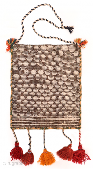 This antique Qashqai chanteh or bag has a geometric grid pattern on the front that plays with the contrast of light and dark colors. Wool and cotton are spun extremely fine. The  ...