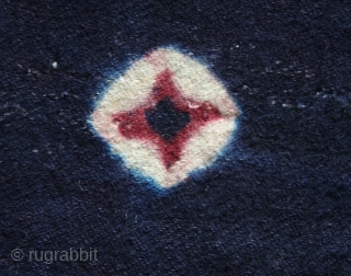 Tigma monastery runner  "Nambu" fragment cod. 0722. Tied-dyed wool plain weave. Tibet. Circa 1850 or earlier. Good condition with some holes, patches, rewoven. Cm. 84 x 140 (33” x 55”).  